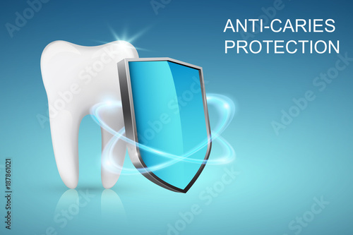 Healthy tooth and shield, anti-caries protection concept photo