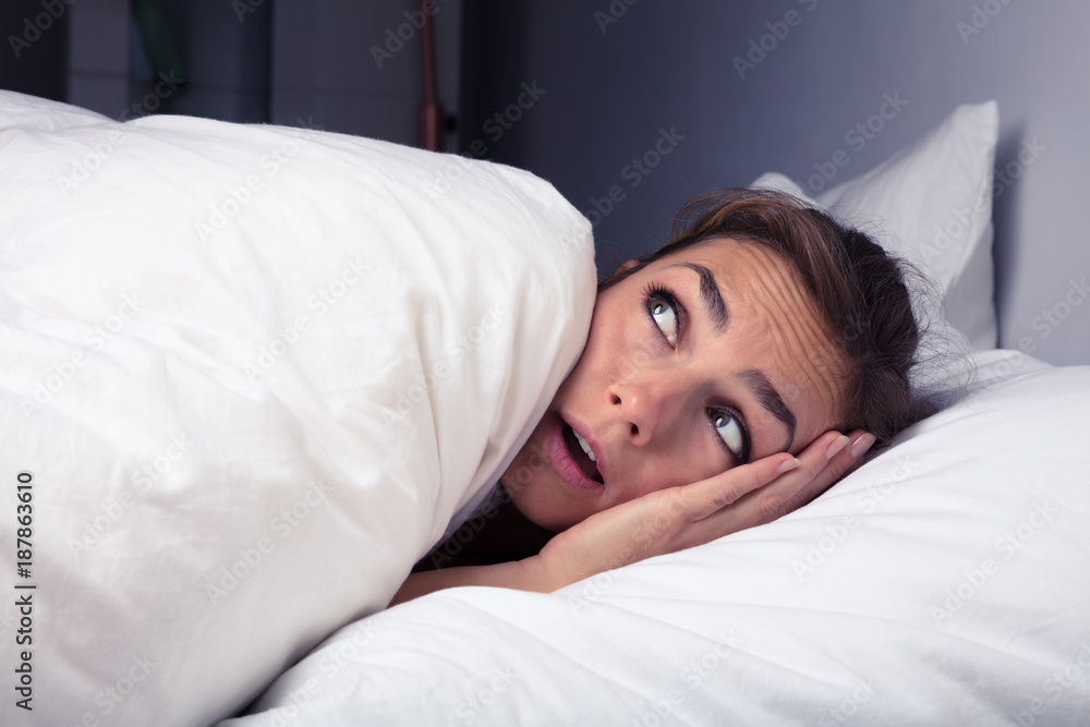 Woman Pulling Bed Sheet Over Self Woman Pulling Bed Sheet Over Self