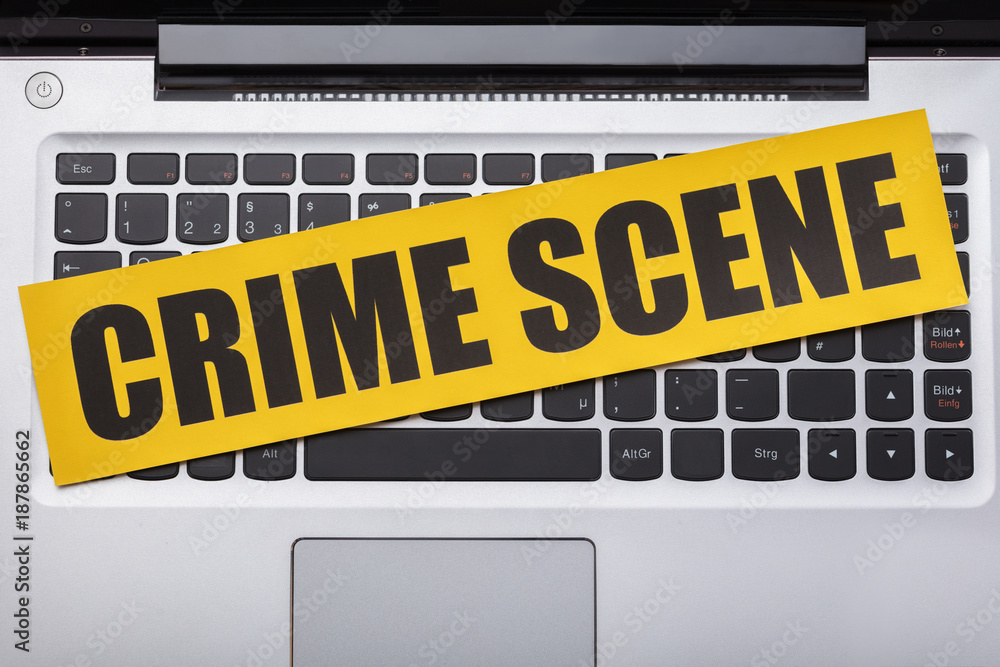 Crime Scene Tape On Laptop Keypad Crime Scene Tape On Laptop Keypad