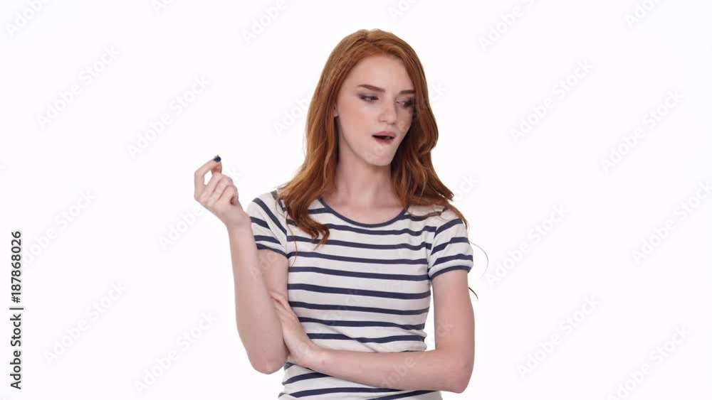 Displeased young redhair lady chewing bubble gum isolated over white wall background
Displeased young redhair lady chewing bubble gum isolated over white wall background