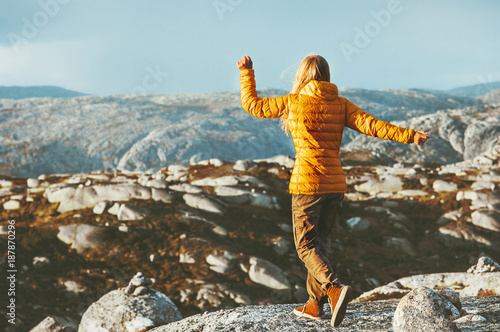 Woman walking outdoor enjoying mountains Travel healthy Lifestyle success wellness emotions fun concept adventure vacations in Norway