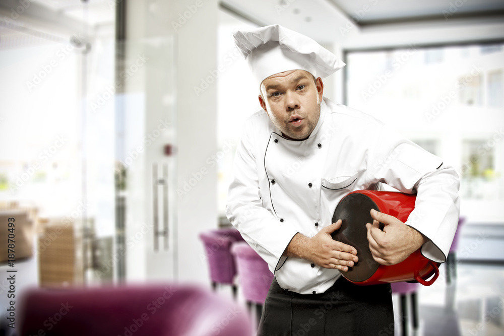 Obraz premium Cook chef in restaurant interior 