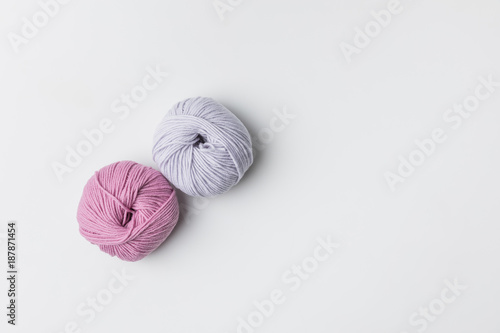 top view of two yarn balls isolated on white with copy space