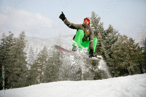 Snowboarder in jump at ski resort in the mountain-winter sport