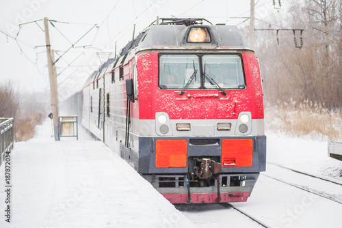transportation. train arriving at the railway station in winter