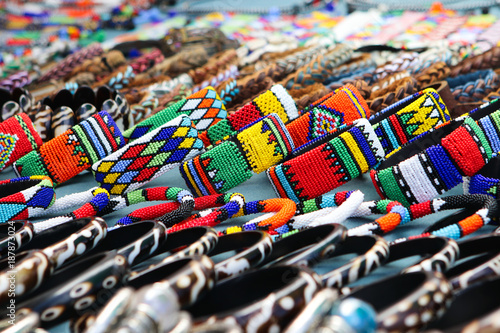 Colorful handmade bracelets, bangles at local craft market in South Africa photo