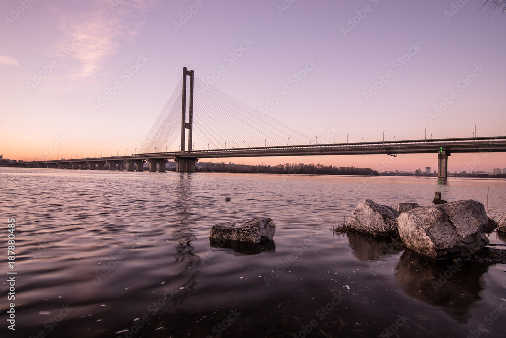 Beautiful glowing bridge over the river Beautiful glowing bridge over the river