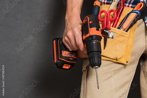 Hand holding construction tools photo