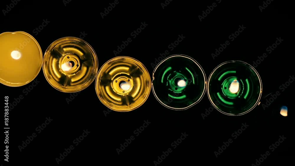 Close up of a abstract a lot of a little wax candles slowly burning