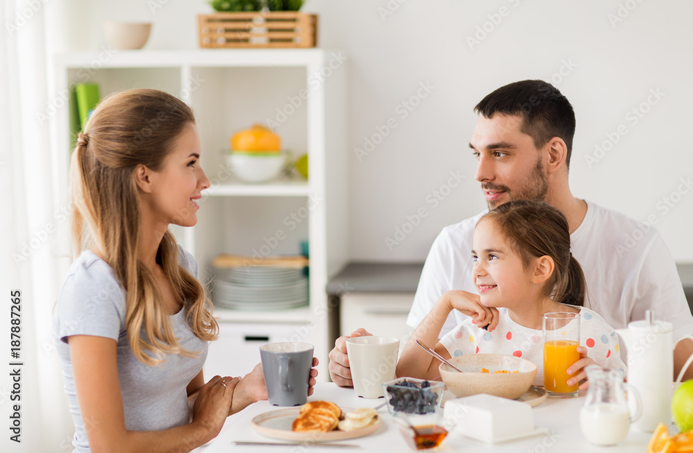 happy family having breakfast at home happy family having breakfast at home