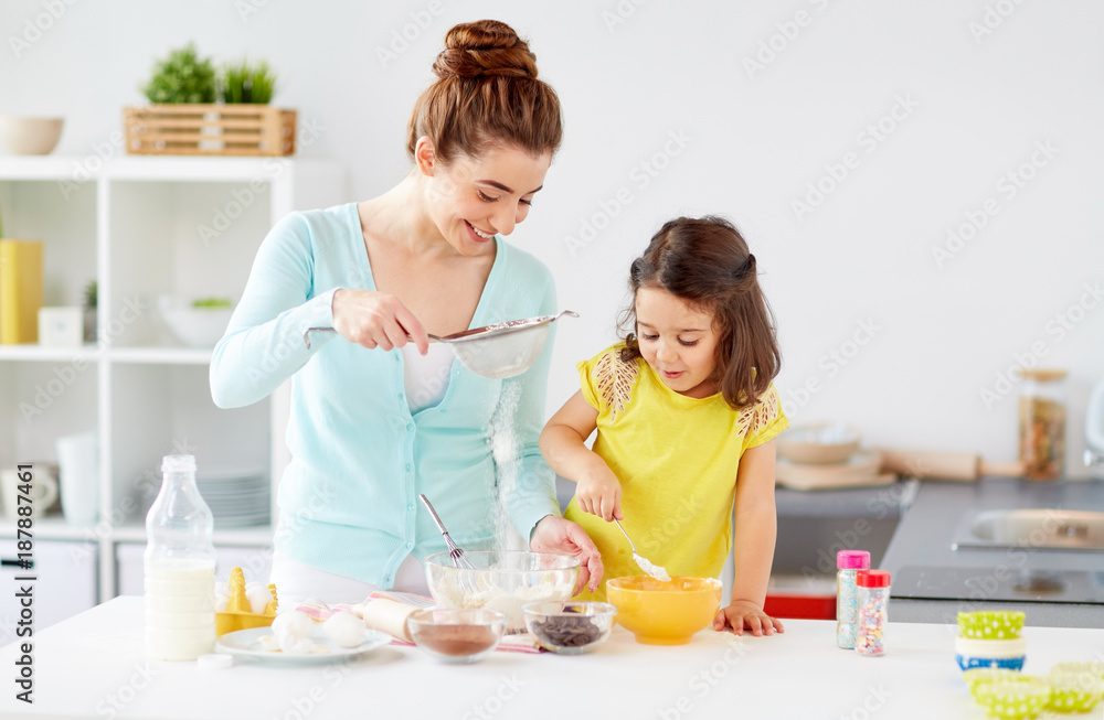 happy mother and daughter baking at home happy mother and daughter baking at home
