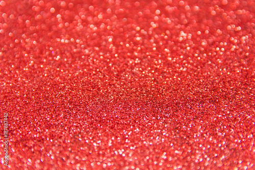 Red glitter defocused texture background. Red christmas abstract background