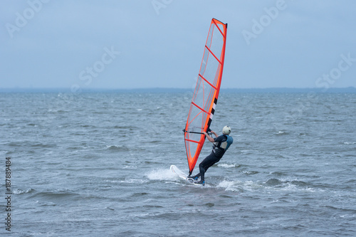 Man wind surfing in the ocean outside the Swedish east coast