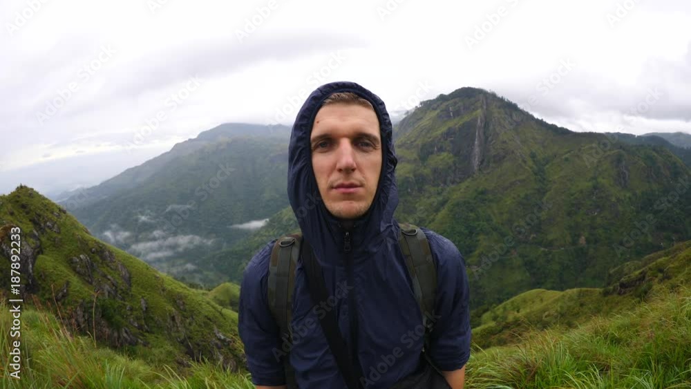 Portrait Of Male Hiker On Top Of Mountain. 4K. Portrait Of Male Hiker On Top Of Mountain. 4K.