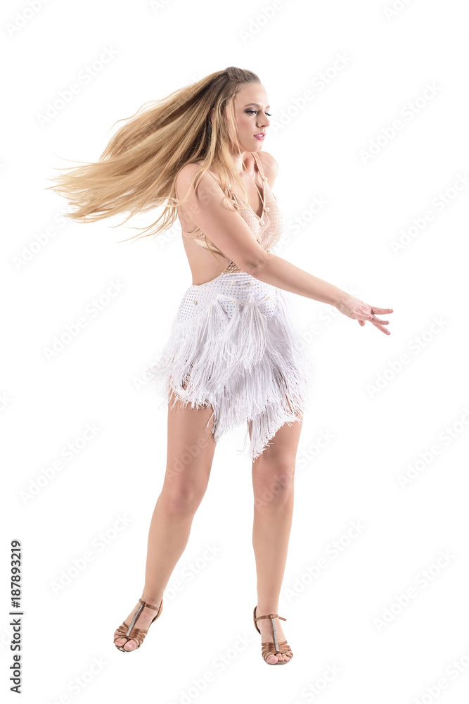 Spinning professional woman dancer with flowing dress and hair motion. Full body length portrait isolated on white studio background. Spinning professional woman dancer with flowing dress and hair motion. Full body length portrait isolated on white studio background.