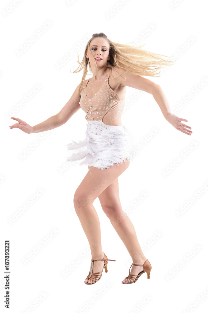 Stopped action motion of skillful professional female dancer with flowing hair and dress. Full body length portrait isolated on white background. Stopped action motion of skillful professional female dancer with flowing hair and dress. Full body length portrait isolated on white background.