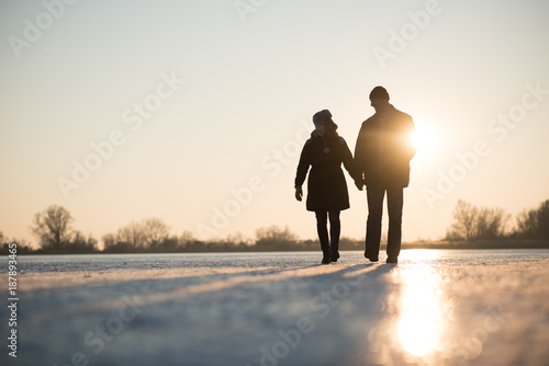 Love couple walking while holding hands