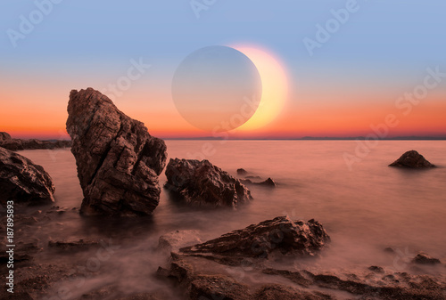 Long Exposure of colorful sunset with solar eclipse 