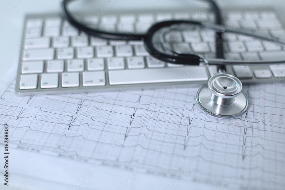Close up of stethoscope on pc keyboard. Healthcare concept Close up of stethoscope on pc keyboard. Healthcare concept