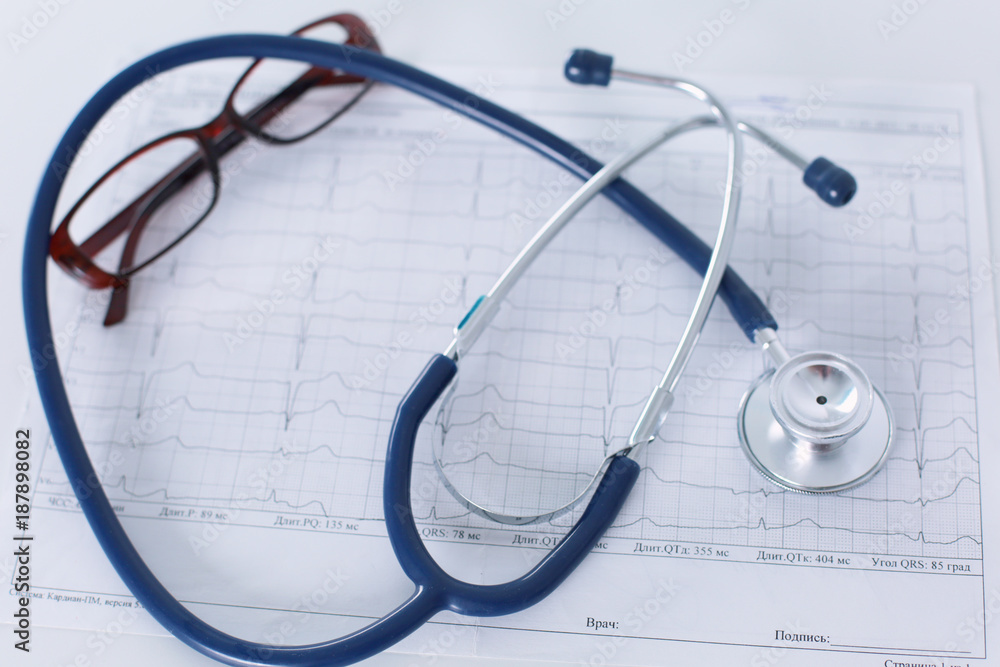 docter workplace with a stethoscope Cardiogram chart with medical table closeup,for heart record docter workplace with a stethoscope Cardiogram chart with medical table closeup,for heart record