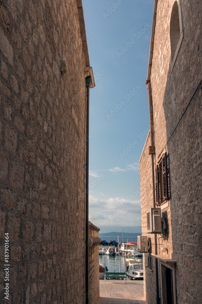 Pedestrian access between buildings in the Bol port area, on the island of Brac, Croatia.