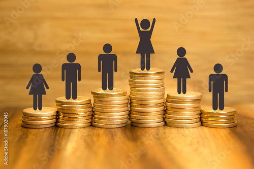 Bonus sales goal concept. Golden coins piles and first place woman winner. Business financial success.