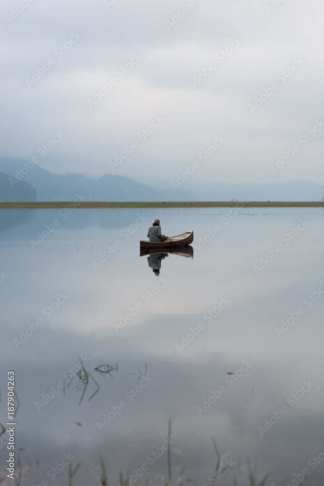 Man traveling in boat on sea Man traveling in boat on sea
