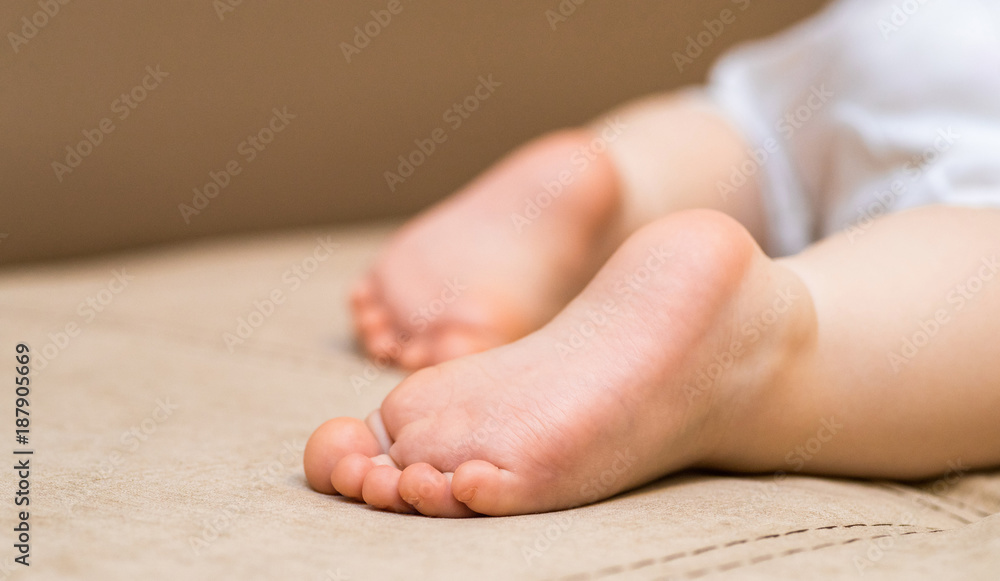 Baby legs. The child is sleeping Baby legs. The child is sleeping