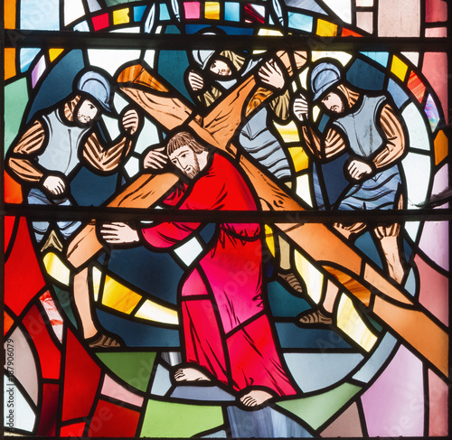 LONDON, GREAT BRITAIN - SEPTEMBER 16, 2017: The stained glass of Jesus under the cross in church St Etheldreda by Charles Blakeman (1953 - 1953). photo