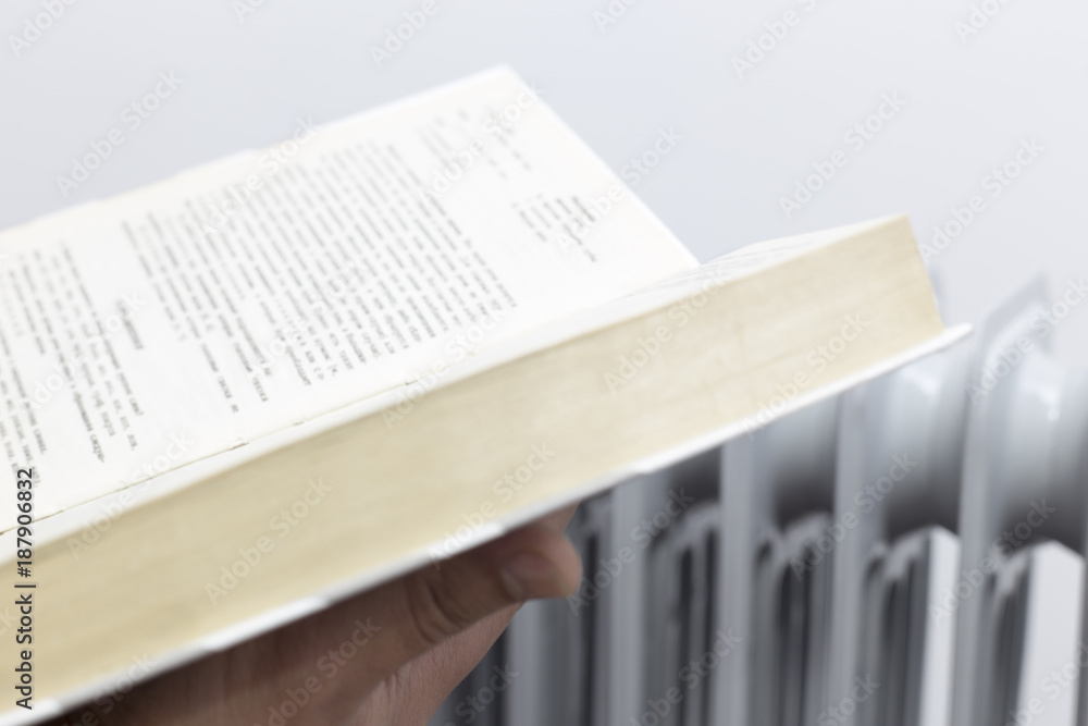 Fototapeta premium a man heating and reading book