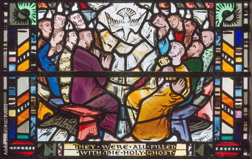 LONDON, GREAT BRITAIN - SEPTEMBER 16, 2017: The scene of Pentecost on the stained glass in church St Etheldreda by Charles Blakeman (1953 - 1953).
