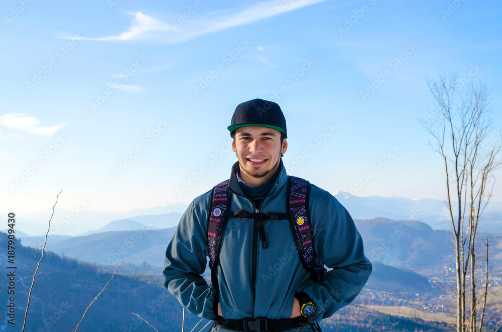 Young man standing outdoors in winter Young man standing outdoors in winter