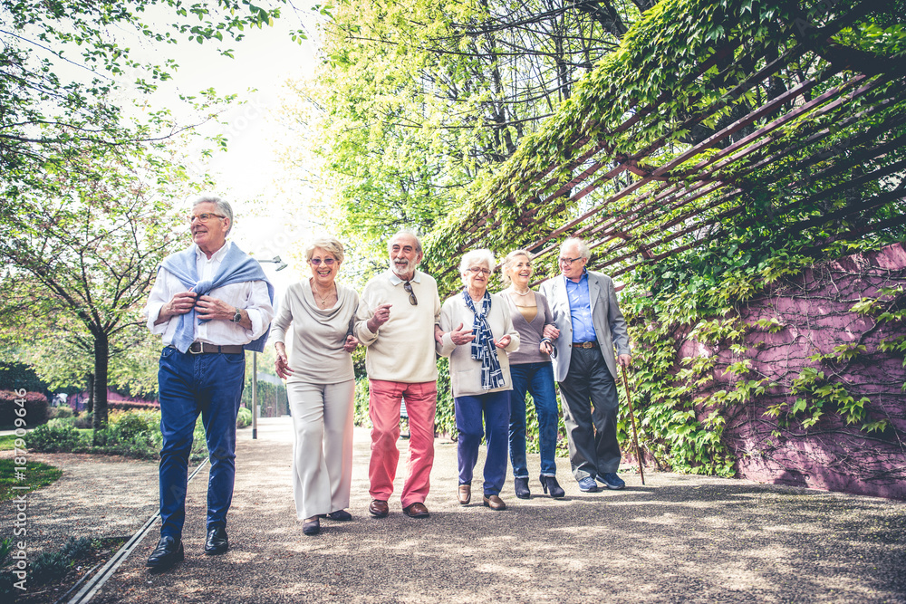 Senior people walking outdoors Senior people walking outdoors