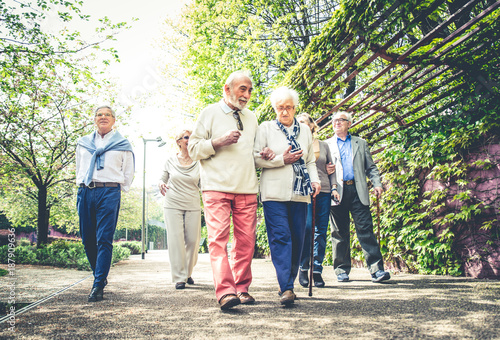 Senior people walking outdoors