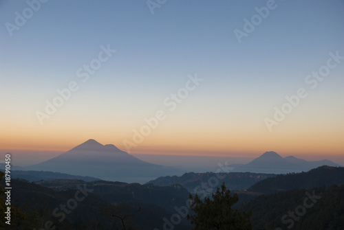 Panoramic view at dawn of volcano atitlan  from road  dramatic colorful  rural landscape of Guatemala.