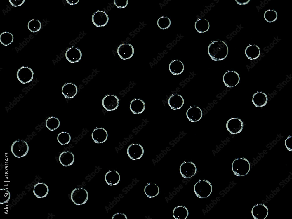  Oxygen bubbles in water on a black  background