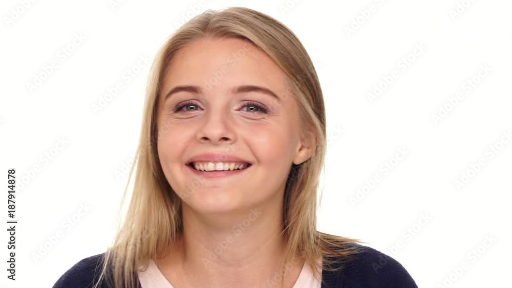 Close up view of Surprised blonde woman looking at the camera over white background
Close up view of Surprised blonde woman looking at the camera over white background