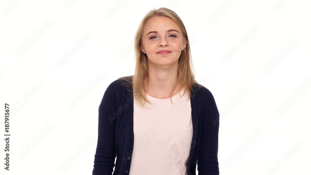 Happy blonde woman in cardigan clapping and showing thumb up over white background
Happy blonde woman in cardigan clapping and showing thumb up over white background