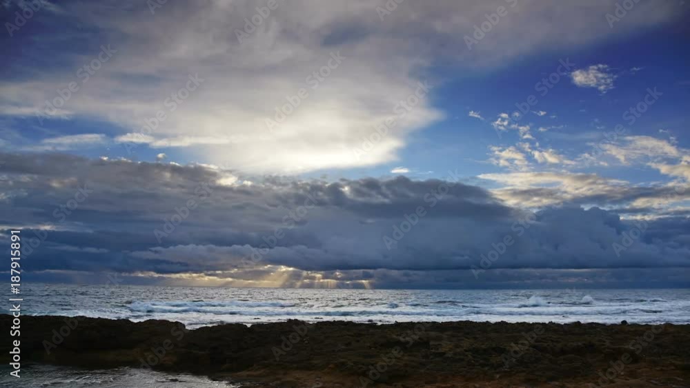 Cloudy sky over the sea at sunset. Alghero, Italy. Time lapse effect Cloudy sky over the sea at sunset. Alghero, Italy. Time lapse effect