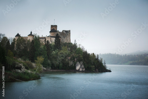 Medieval castle on the hill by the lake. Niedzlica , Poland