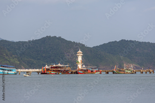 Lighthouse on a pier on Koh Chang Island in Thailand photo