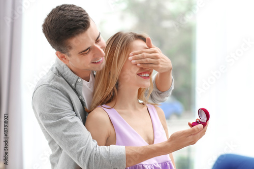 Man with engagement ring ma...