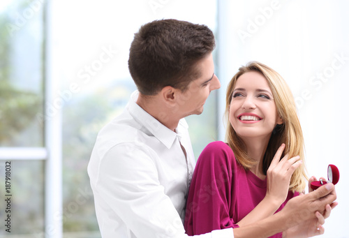 Man with engagement ring ma...