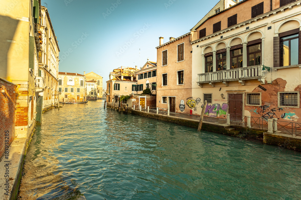 VENICE, ITALY - JANUARY 02 2018: Venetian canal with colorful houses