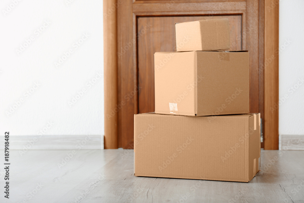 Delivered parcels on floor near front door Delivered parcels on floor near front door