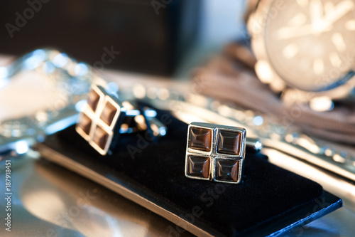 shiny cufflinks with gemstones