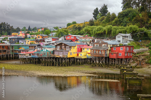 Traditional wooden houses built on stilts (palafitos) along the waters edge in Castro, Chiloe, Chile