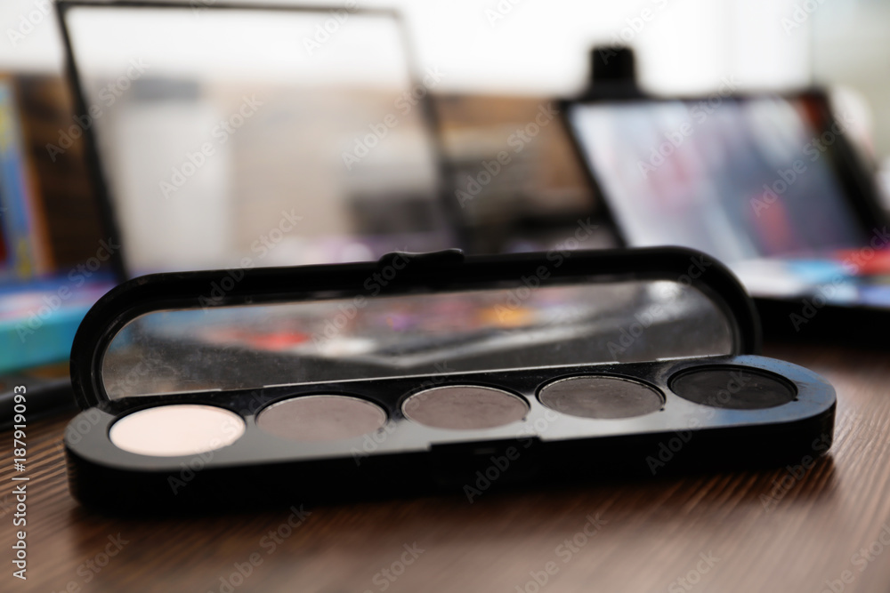 Eyeshadow palette of professional makeup artist on dressing table Eyeshadow palette of professional makeup artist on dressing table
