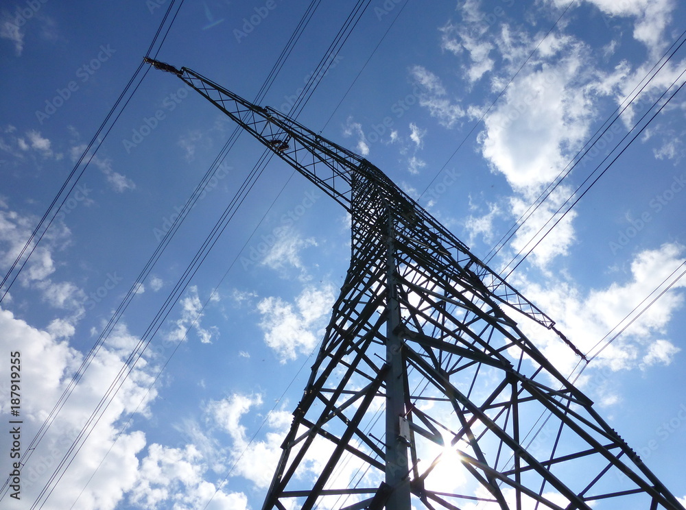 Large transmission tower under the blue sunny sky Large transmission tower under the blue sunny sky