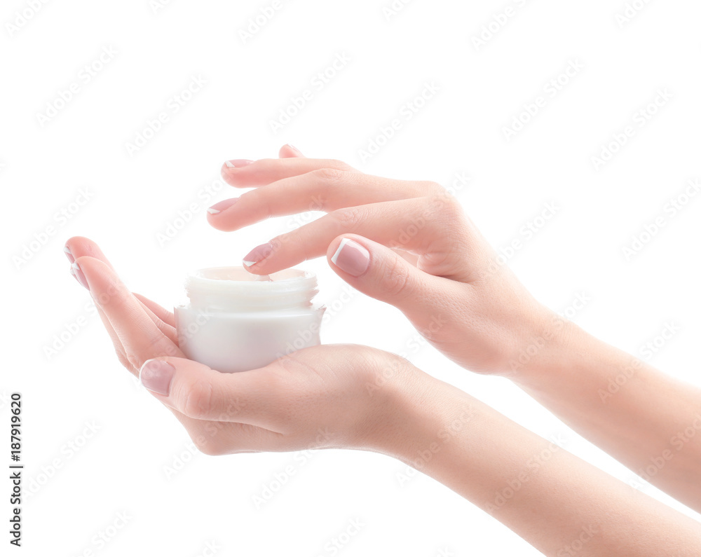 Young woman holding jar of hand cream on white background Young woman holding jar of hand cream on white background
